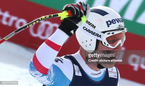 Romed Baumann of Austria reacts during the men's super combined-downhill at the Alpine Skiing World Championships in Schladming, Austria, 11 February...