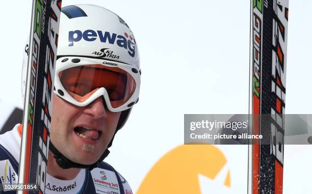 Romed Baumann of Austria reacts during the men's super combined-downhill at the Alpine Skiing World Championships in Schladming, Austria, 11 February...