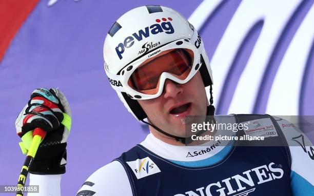 Romed Baumann of Austria reacts during the men's super combined-downhill at the Alpine Skiing World Championships in Schladming, Austria, 11 February...