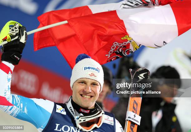 Romed Baumann of Austria reacts during the second run of the men's super combined-downhill at the Alpine Skiing World Championships in Schladming,...