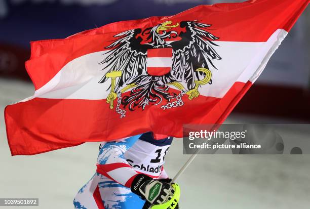 Romed Baumann of Austria reacts during the second run of the men's super combined-downhill at the Alpine Skiing World Championships in Schladming,...