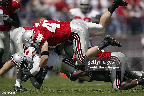 Ohio State A.J. Hawk of Scarlet squad in action, making tackle vs Santonio Holmes of Gray squad during Buckeyes Spring Game at Ohio Stadium....