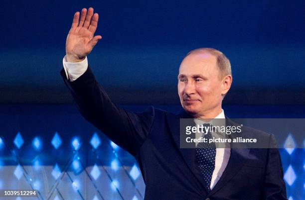 Russian President Vladimir Putin is seen during the Opening Ceremony in Fisht Olympic Stadium at the Sochi 2014 Paralympic Winter Games, Sochi,...