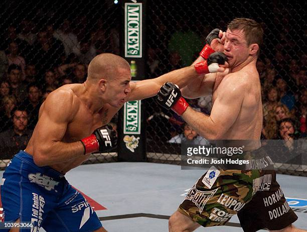 Georges St-Pierre punches Matt Hughes at UFC 65 at the Arco Arena on November 18, 2006 in Sacramento, California.