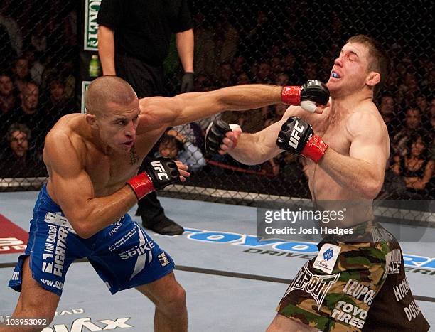 Georges St-Pierre punches Matt Hughes at UFC 65 at the Arco Arena on November 18, 2006 in Sacramento, California.