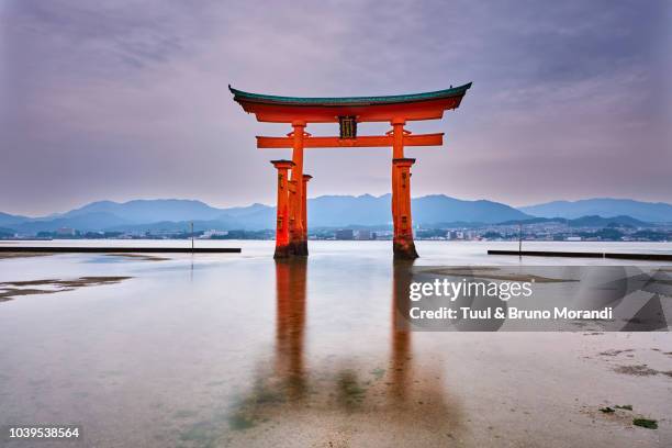japan, miyajima island, itsukushima shrine, torii gate, unesco - torii gate stock pictures, royalty-free photos & images