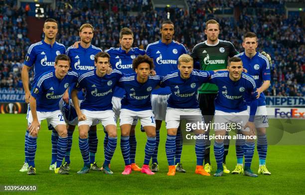 Schalke's squad poses for a group picture, including Franco Di Santo, Benedikt Hoewedes, Klaas-Jan Huntelaar, Joel Matip, goalkeeper Ralf Faehrmann,...
