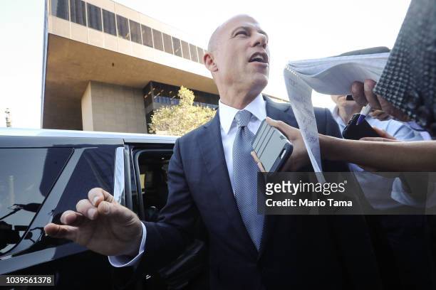 Michael Avenatti, attorney for Stephanie Clifford, also known as adult film actress Stormy Daniels, speaks to reporters as he leaves the U.S....