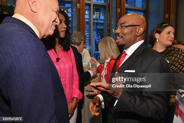 Businessman and author Jim Ovia greets guests at a discussion of his book, Africa Rise And Shine: How A Nigerian Entrepreneur From Humble Beginnings...