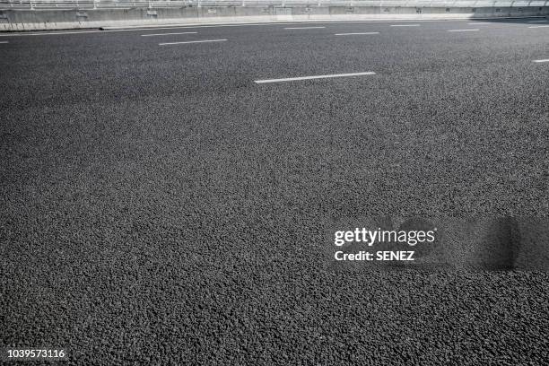 full frame shot of asphalt road - tejer stock-fotos und bilder