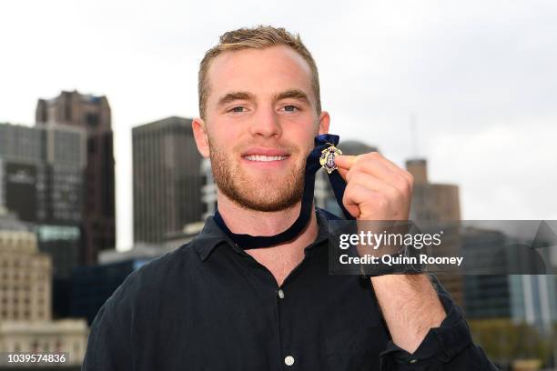 Tom Mitchell of the Hawthorn Hawks poses with the 2018 Brownlow Medal at Crown Entertainment Complex on September 25, 2018 in Melbourne, Australia.