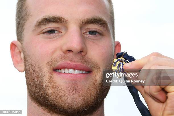 Tom Mitchell of the Hawthorn Hawks poses with the 2018 Brownlow Medal at Crown Entertainment Complex on September 25, 2018 in Melbourne, Australia.