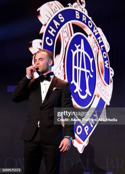 Tom Mitchell of the Hawks poses with the Brownlow Medal during the 2018 Brownlow Medal Count at Crown Palladium on September 24, 2018 in Melbourne,...