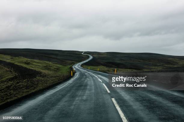 beautiful road in iceland - dark country road stock pictures, royalty-free photos & images