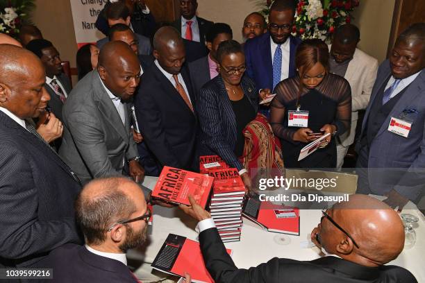 Businessman and author Jim Ovia signs copies of his book, Africa Rise And Shine: How A Nigerian Entrepreneur From Humble Beginnings Grew A Business...