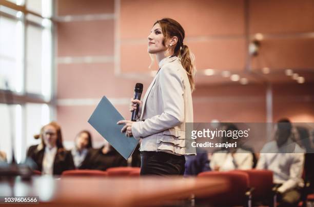 business people listening to the speaker at a conference - speech stock pictures, royalty-free photos & images