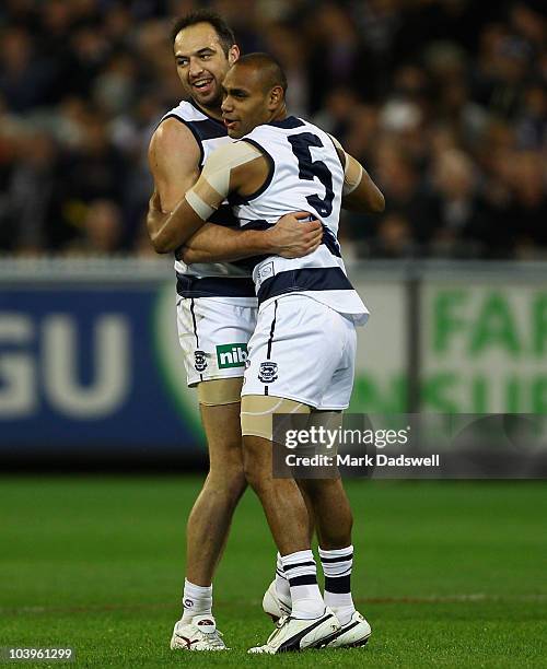 James Podsiadly of the Cats celebrates a goal with Travis Varcoe during the AFL Second Semi Final match between the Geelong Cats and the Fremantle...