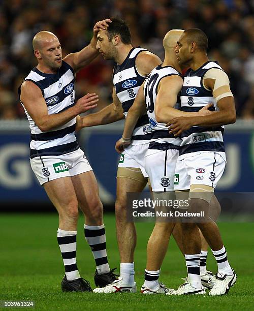 James Podsiadly of the Cats celebrates a goal with teammates during the AFL Second Semi Final match between the Geelong Cats and the Fremantle...