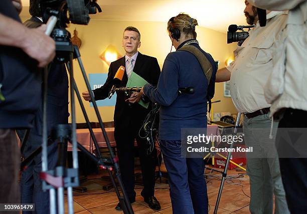 Berlin parliamentarian Rene Stadtkewitz speaks to the media after a pressconference to announce the creation of a new right -of-center political...