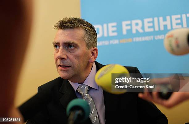 Berlin parliamentarian Rene Stadtkewitz speaks to the media to announce the creation of a new right -of-center political party at Belair hotel on...