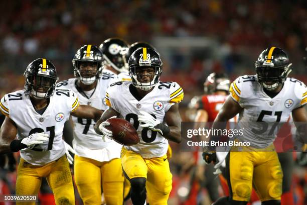 Cornerback Mike Hilton of the Pittsburgh Steelers runs with the ball following his interception during the second quarter of a game against the Tampa...