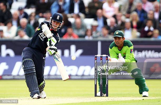 Steve Davies of England hits out watched by wicketkeeper Kamran Akmal of Pakistan during the 1st NatWest One Day International between England and...