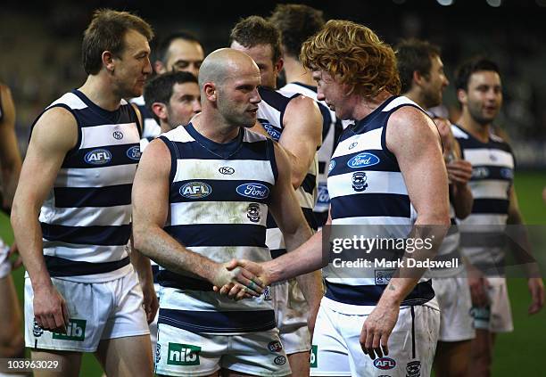 Paul Chapman and Cameron Ling of the Cats celebrate their win in the AFL Second Semi Final match between the Geelong Cats and the Fremantle Dockers...