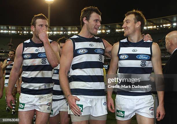 Steve Johnson, Cameron Mooney and Darren Milburn of the Cats celebrate their win in the AFL Second Semi Final match between the Geelong Cats and the...