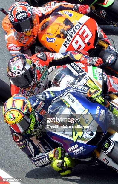 Spanish MotoGP rider Marc Marquez of the Repsol Honda team, German MotoGP rider Stefan Bradl of the LCR Honda team and Italian MotoGP rider Valentino...