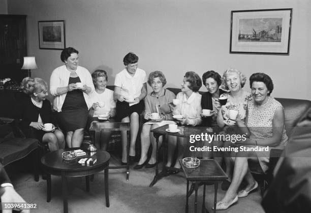 Barbara Castle , Secretary of State for Employment and Productivity, shares a cup of tea with the leaders of the female machinists' strike from the...