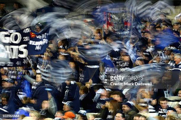Geelong fans celebrate a goal during the AFL Second Semi Final match between the Geelong Cats and the Fremantle Dockers at Melbourne Cricket Ground...