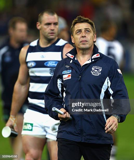 Relaxed Mark Thompson coach of the Cats leaves the ground at three quarter time during the AFL Second Semi Final match between the Geelong Cats and...