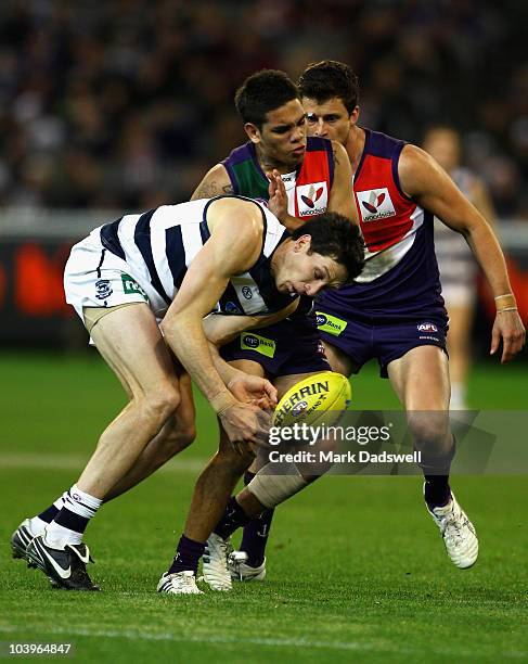 Harry Taylor of the Cats is tackled by Michael Walters of the Dockers during the AFL Second Semi Final match between the Geelong Cats and the...