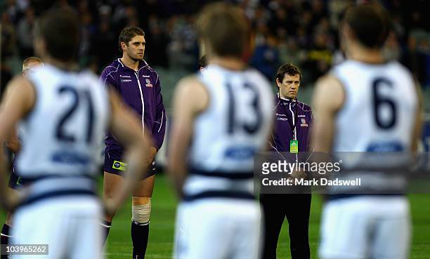 Fremantle Dockers coach Mark Harvey and Aaron Sandilands take part in the National Anthem during the AFL Second Semi Final match between the Geelong...