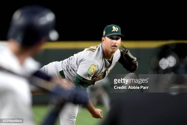 Daniel Mengden of the Oakland Athletics pitches against the Seattle Mariners in the first inning during their game at Safeco Field on September 24,...