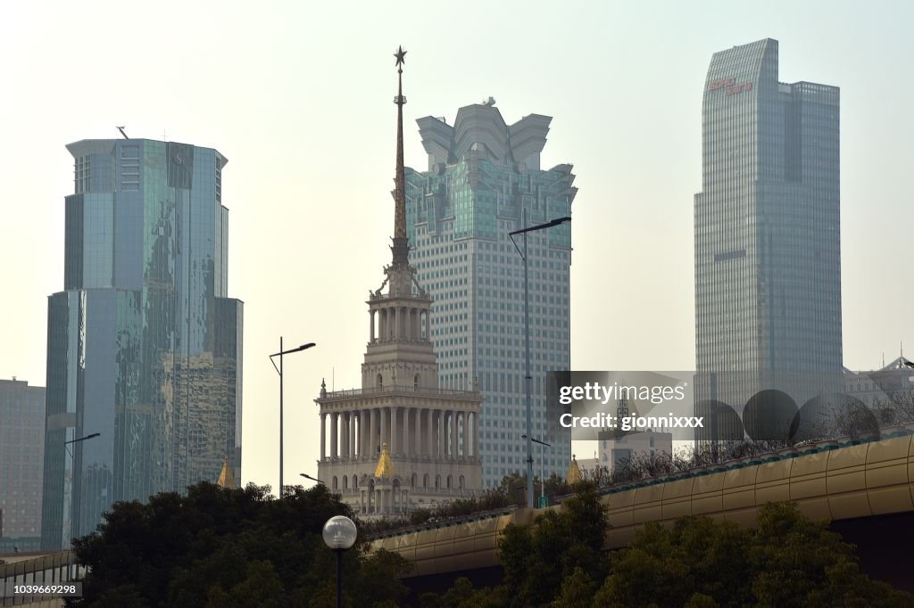 Jing'an district skyline and Shanghai Exhibition Centre building, China