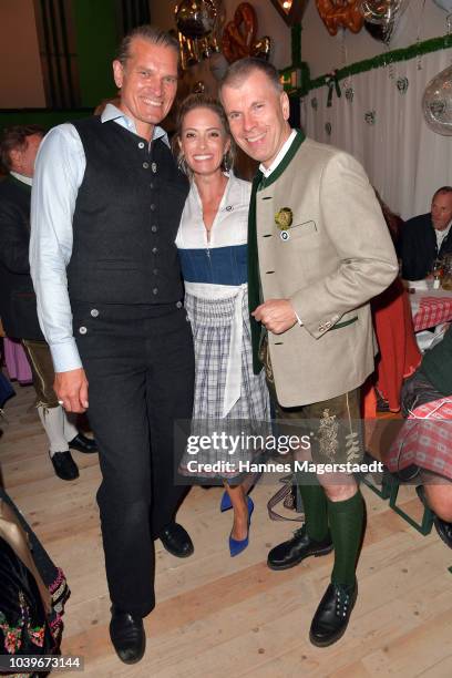 Actor Goetz Otto, Sarah Winkhaus and Peter Mey, Director BMW Niederlassung Muenchen, during the BMW Armbrustschiessen as part of the Oktoberfest 2018...