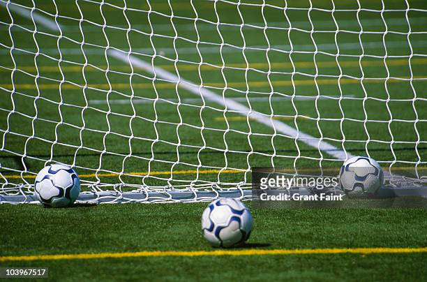 three soccer / footballs - soccer goal stock-fotos und bilder