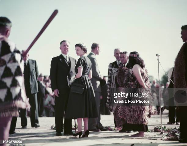 Queen Elizabeth II at Ngaruawahia, New Zealand, during her coronation world tour, 30th December 1953. With her are: Prime Minister of New Zealand,...