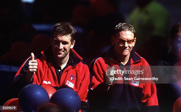 Melbourne players David Neitz and Shane Woewodin wave to fans, during the AFL Grand Final Parade in the lead up to the Grand Final match between the...