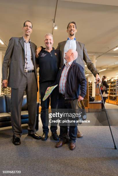 Sultan Koesen , the world's tallest person at 2.51 metres, Brahim Takioullah , the world's second tallest person at 2.46 metres, Rolf Mayer and...