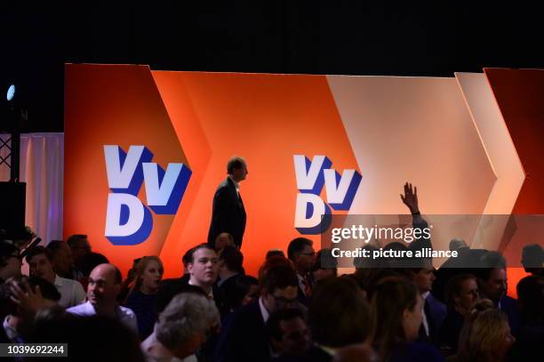 Supporters of the conservative-liberal party VVD of the current Dutch Prime Minister Rutte can be seen at the election party of the party in The...