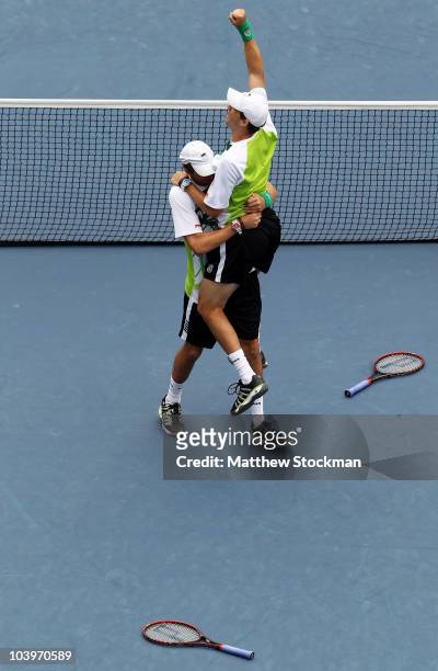 Bob Bryan of the United States and Mike Bryan of the United States celebrate after defeating Rohan Bopanna of India and Aisam-Ul-Haq Qureshi of...