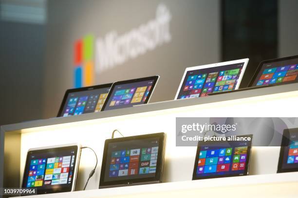 Tablet computers with Windows 8 operating system are displayed at the stand of Microsoft at CeBIT, the world's largest computer expo, in Hanover,...