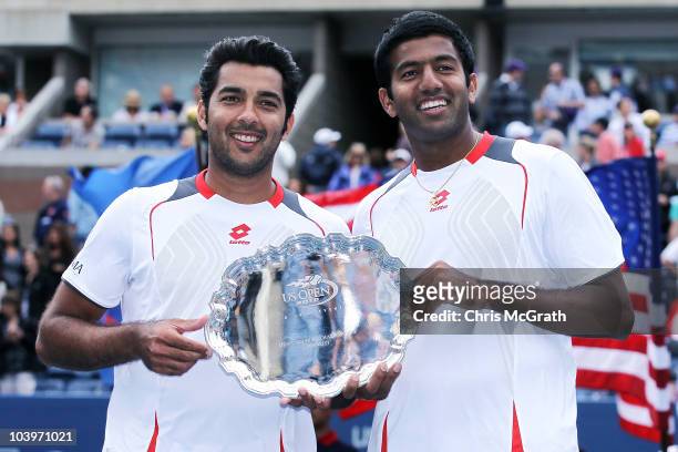 Aisam-Ul-Haq Qureshi of Pakistan and Rohan Bopanna of India hold their trophy after the men's doubles final against Bob Bryan and Mike Bryan on day...