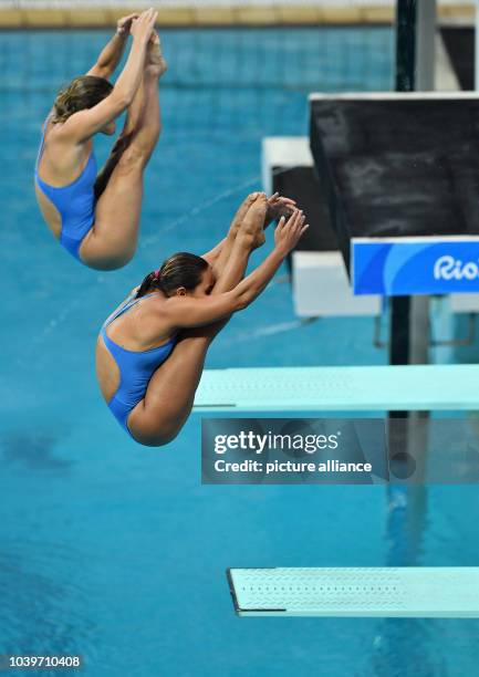 Tammy Takagi an Pamela Veloso of Brazil compete during the Women's Synchronised 3m Springboard Swimming event of the Rio 2016 Olympic Games at the...