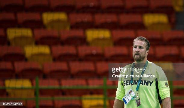 Team manager Oliver Roggisch of Germany in Future Arena looks on during a training session of the national handball team in the Future Arena at...