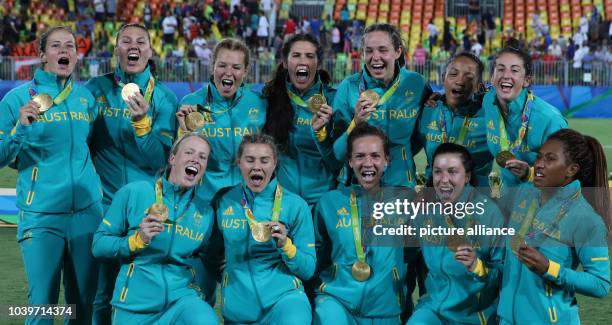 Team of Australia celebrates after winning the women's Rugby Sevens gold medal match between Australia and New Zealand at the Rio 2016 Olympic Games...