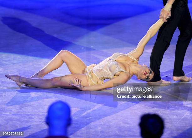 The acrobatic duo 'Maintenant' performs the final act at the starting event of the European gymnastics show 'Feuerwerk der Turnkunst' in the...