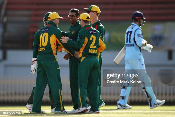 Clive Rose of the Tigers celebrates with his team mates after taking the wicket of Kurtis Patterson of the NSW Blues during the JLT One Day Cup match...